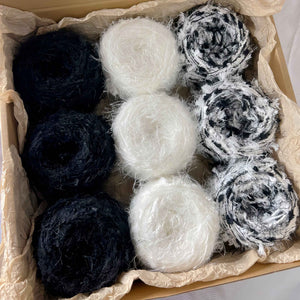 Hand-dyed yarn mystery box clearance sale! Featuring hand-dyed yarn hair ties, knitting and crochet yarns, and mohair yarn.