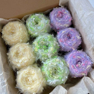 Hand-dyed yarn mystery box clearance sale! Featuring hand-dyed yarn hair ties, knitting and crochet yarns, and mohair yarn.