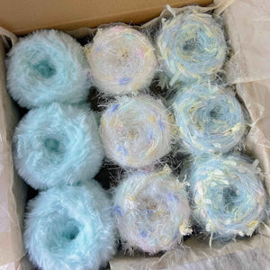 Hand-dyed yarn mystery box clearance sale! Featuring hand-dyed yarn hair ties, knitting and crochet yarns, and mohair yarn.