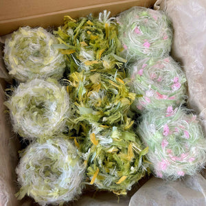 Hand-dyed yarn mystery box clearance sale! Featuring hand-dyed yarn hair ties, knitting and crochet yarns, and mohair yarn.